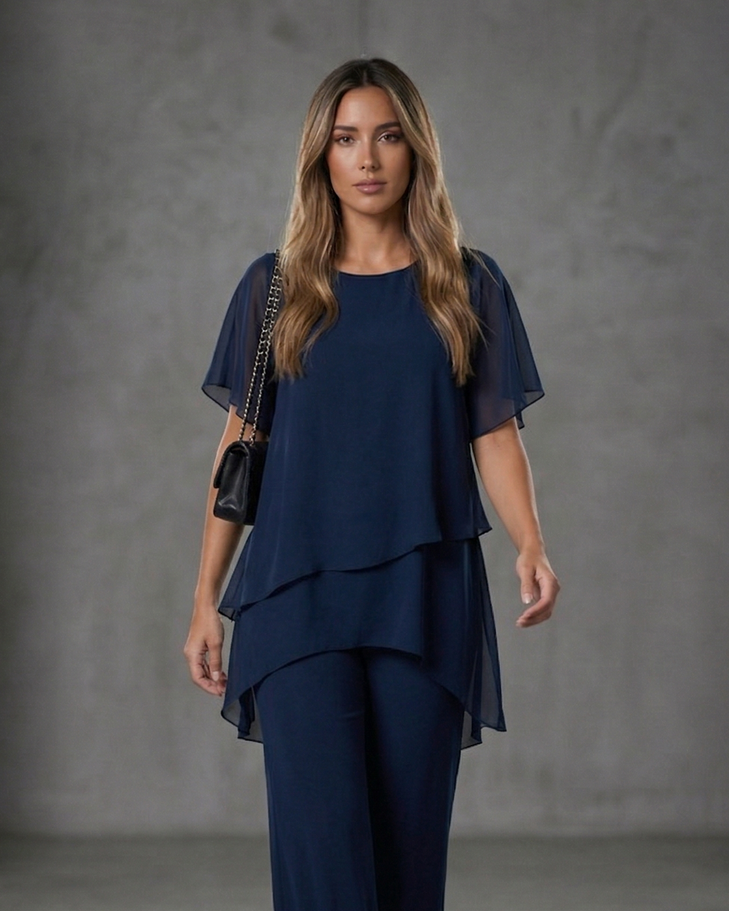 EB Conjunto elegante con top asimétrico y pantalones de pierna ancha.