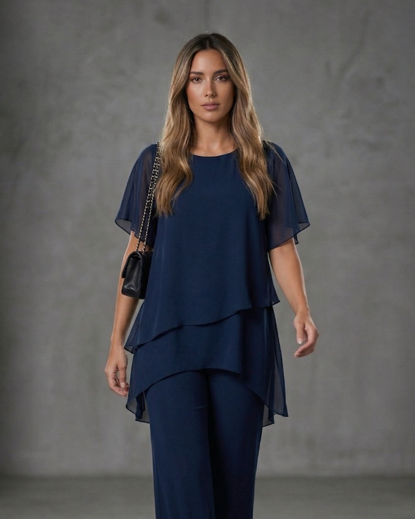 EB Conjunto elegante con top asimétrico y pantalones de pierna ancha.