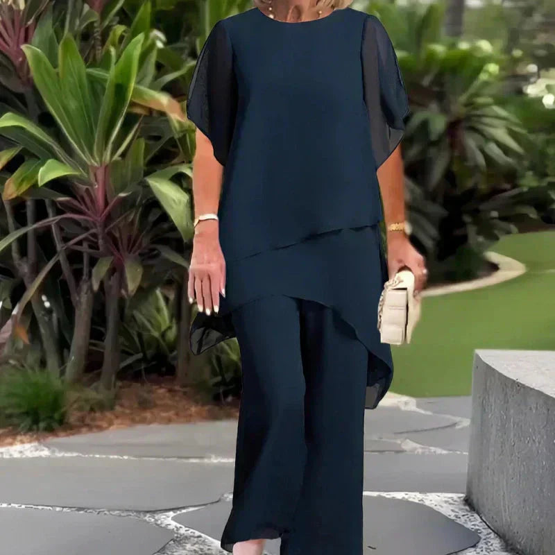 EB Conjunto elegante con top asimétrico y pantalones de pierna ancha.