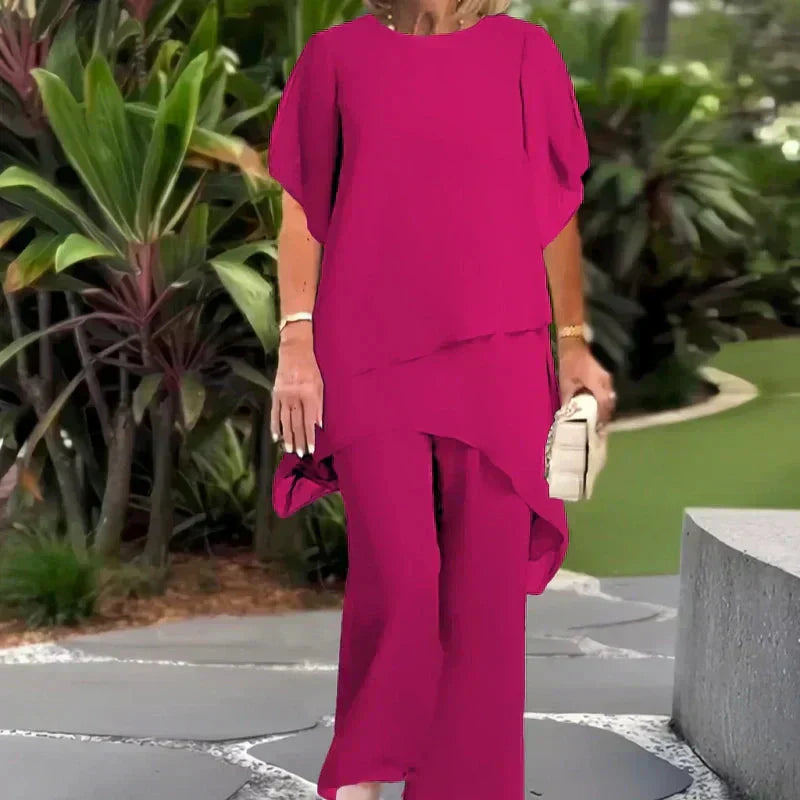 EB Conjunto elegante con top asimétrico y pantalones de pierna ancha.