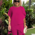 EB Conjunto elegante con top asimétrico y pantalones de pierna ancha.