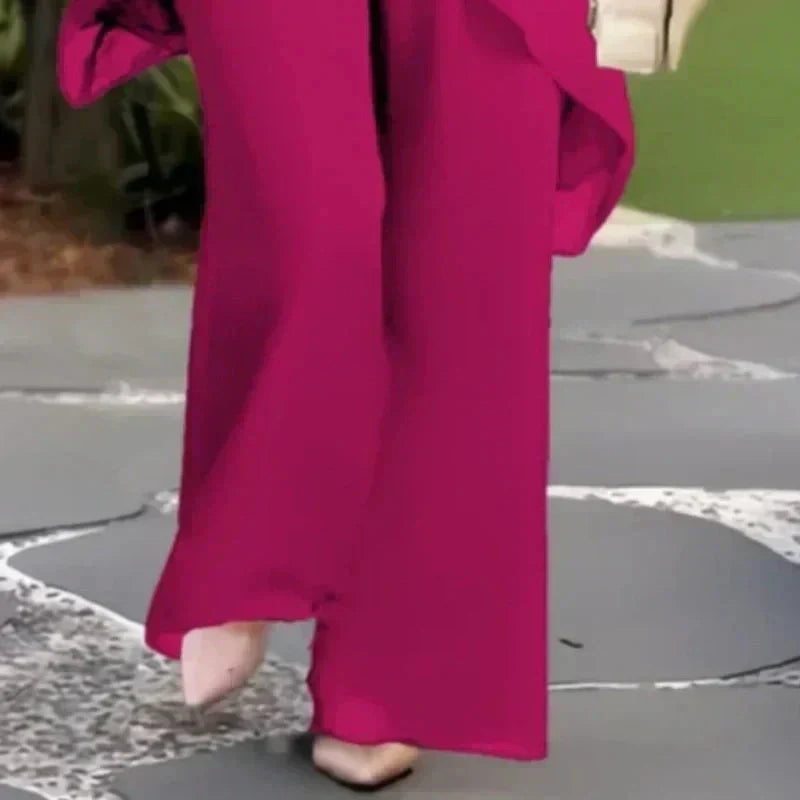 EB Conjunto elegante con top asimétrico y pantalones de pierna ancha.