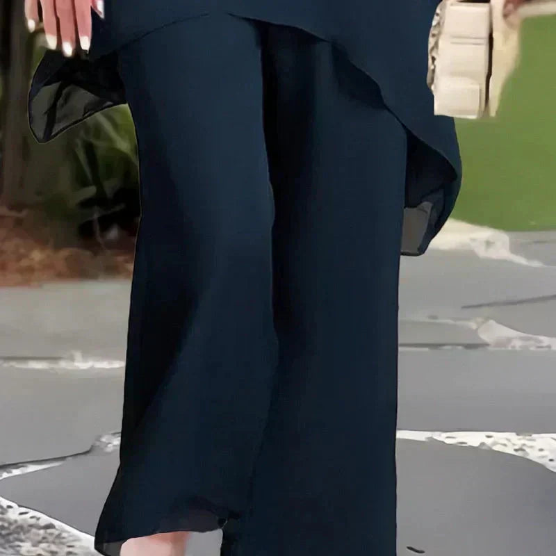 EB Conjunto elegante con top asimétrico y pantalones de pierna ancha.